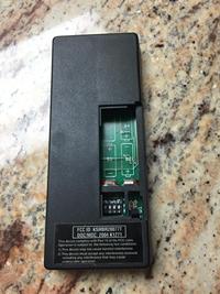 PICTURE OF BATTERY DOOR LOCATION ON BACK OF THE ABOVE E-SERIES CONTROLS.